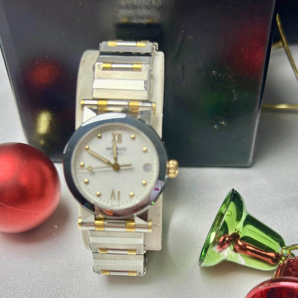 Movado Vizio pre-owned two-tone lady's watch with a white dial and date window